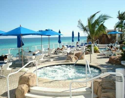 view of pool with a water view