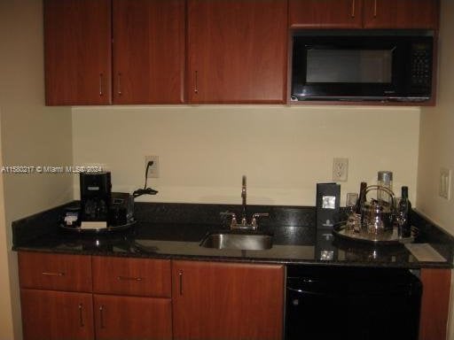 kitchen with black microwave and sink