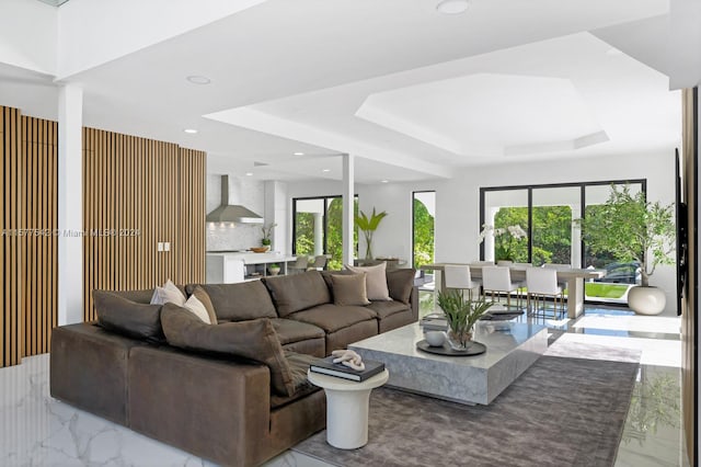 tiled living room with a raised ceiling