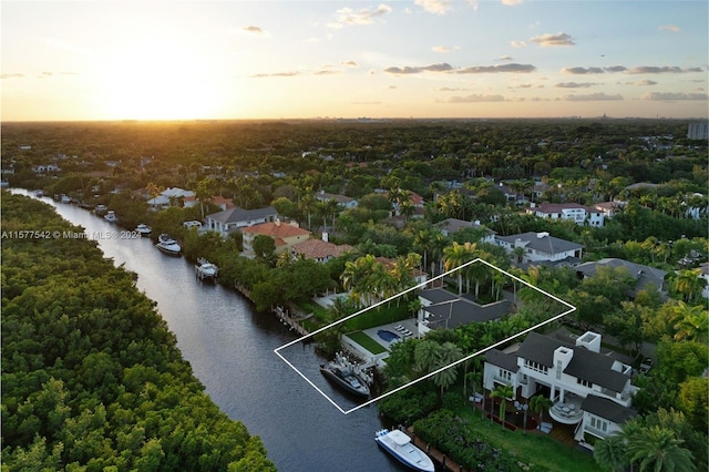 aerial view at dusk with a water view