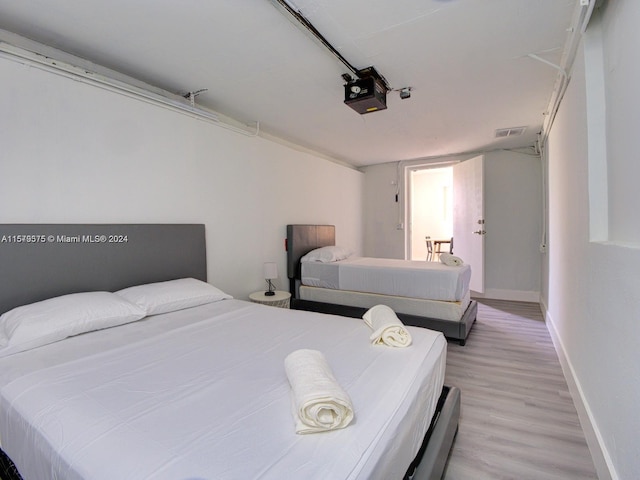 bedroom featuring light hardwood / wood-style floors