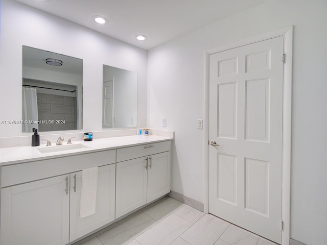 bathroom with tile floors and large vanity