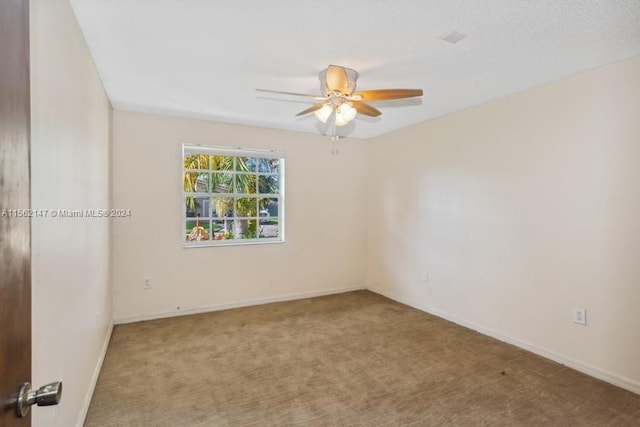 unfurnished room with carpet floors and ceiling fan