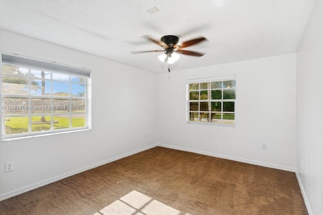 unfurnished room featuring ceiling fan and carpet flooring