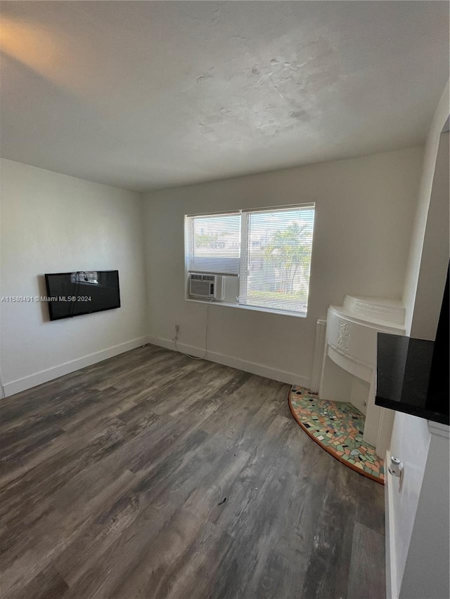 unfurnished living room featuring dark hardwood / wood-style floors