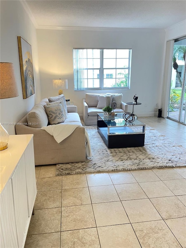 living room with a textured ceiling, light tile floors, and ornamental molding