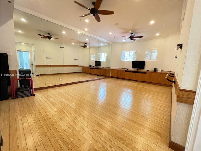 interior space with crown molding, light hardwood / wood-style floors, and ceiling fan