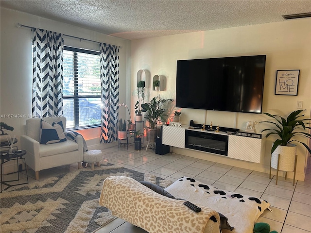 living room featuring tile floors and a textured ceiling