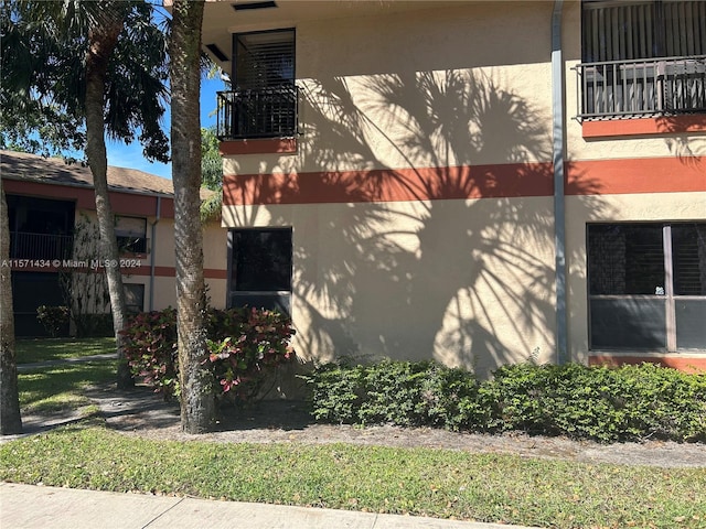 view of property exterior featuring a balcony