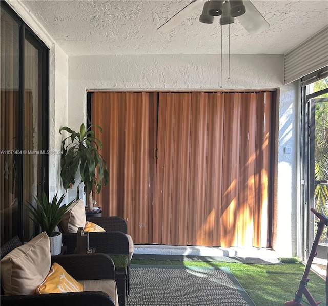 sunroom / solarium with ceiling fan