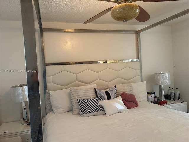 bedroom featuring a textured ceiling and ceiling fan