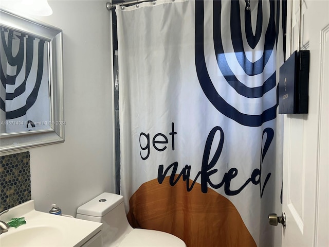 bathroom featuring vanity and toilet