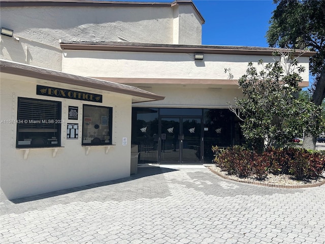 view of exterior entry featuring french doors