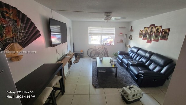 tiled living room featuring ceiling fan