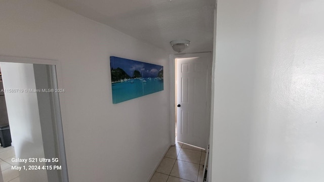 hallway with light tile patterned floors