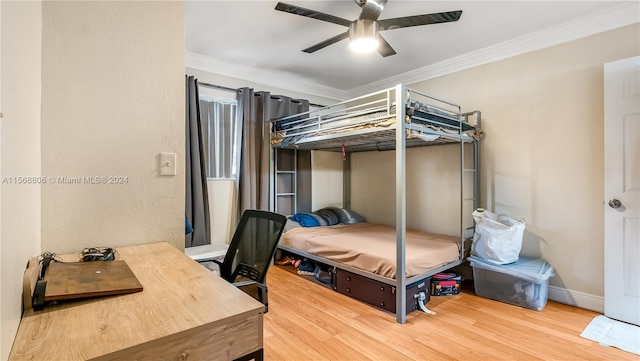 bedroom featuring crown molding, light hardwood / wood-style flooring, and ceiling fan