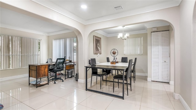 tiled dining space with an inviting chandelier and ornamental molding