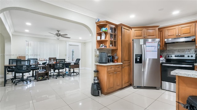 kitchen featuring ornamental molding, stainless steel appliances, ceiling fan, and backsplash