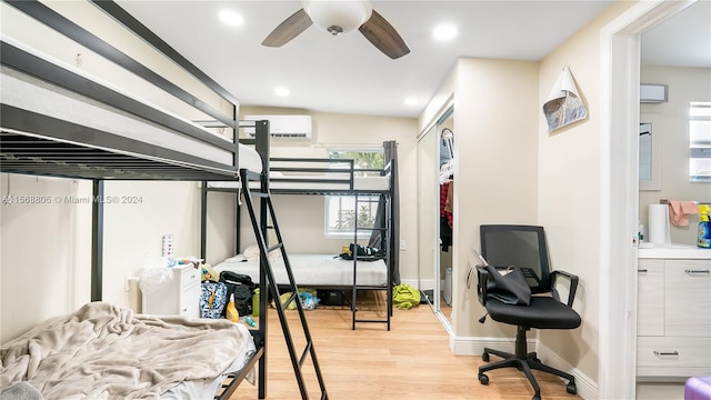 bedroom with light hardwood / wood-style flooring and ceiling fan