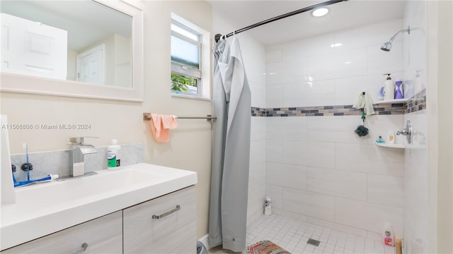 bathroom featuring vanity and curtained shower