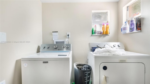 laundry area featuring washer hookup and washer and dryer