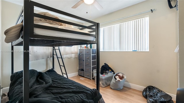 bedroom featuring light hardwood / wood-style flooring and ceiling fan