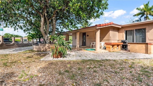 back of house with a patio area