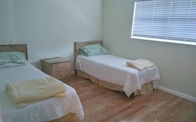 bedroom with light hardwood / wood-style flooring