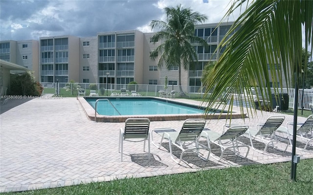 view of swimming pool with a patio