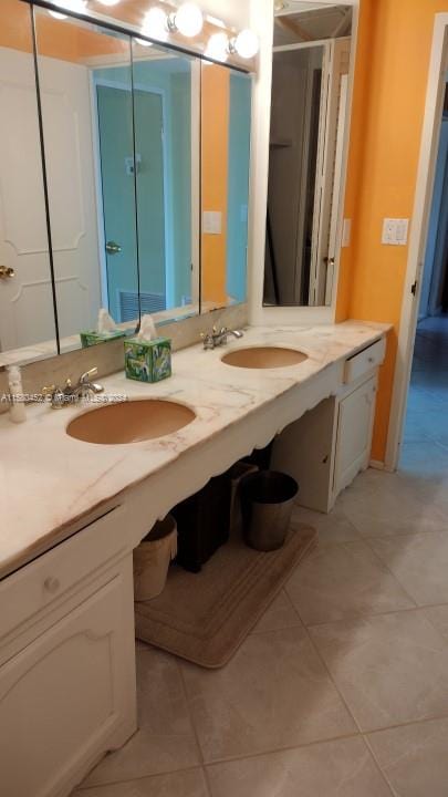 bathroom featuring vanity and tile patterned flooring