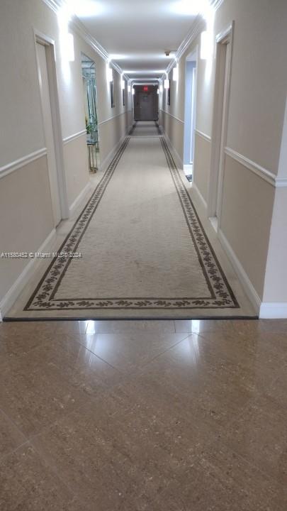 hallway with ornamental molding