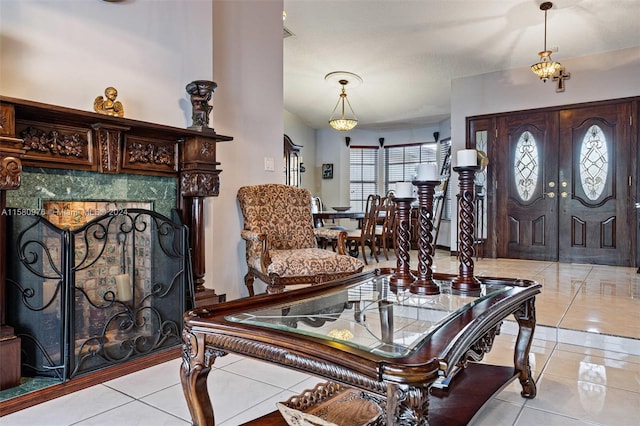 tiled entryway featuring french doors and a textured ceiling