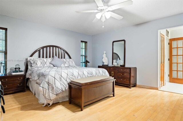 bedroom with light hardwood / wood-style flooring and ceiling fan