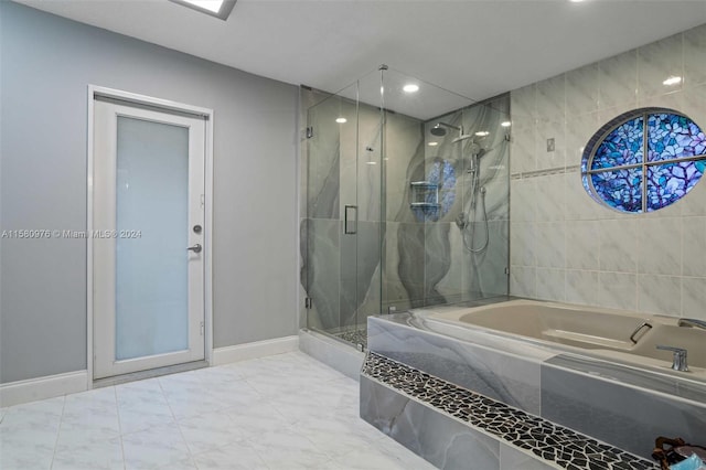 bathroom featuring plus walk in shower