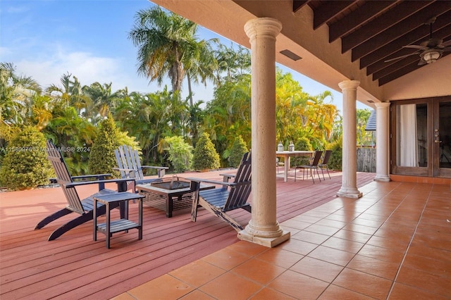 wooden terrace with an outdoor fire pit