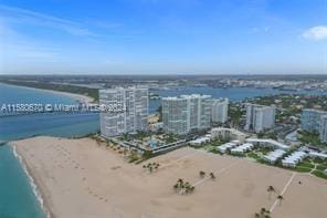 bird's eye view featuring a beach view and a water view