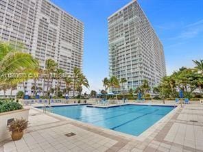 view of swimming pool with a patio area