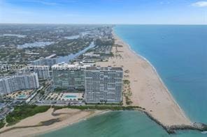 bird's eye view with a view of the beach and a water view