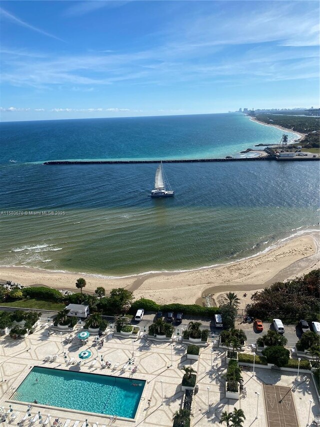 bird's eye view with a beach view and a water view