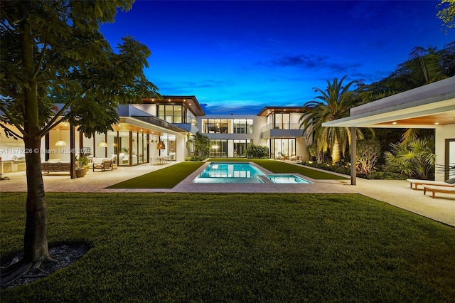 outdoor pool featuring a yard and a patio