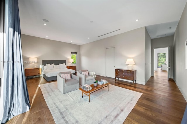 bedroom with dark wood-type flooring