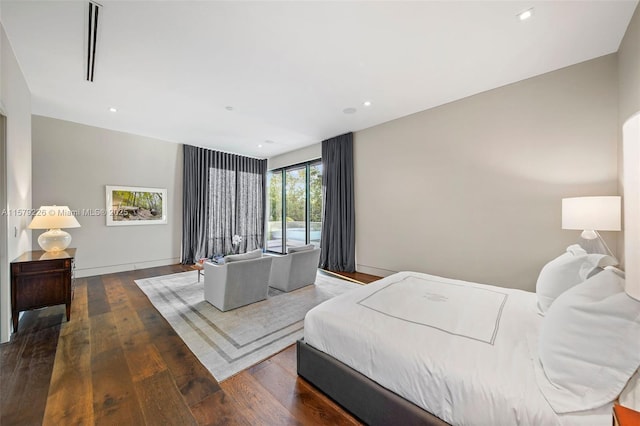 bedroom featuring recessed lighting, access to exterior, and wood-type flooring