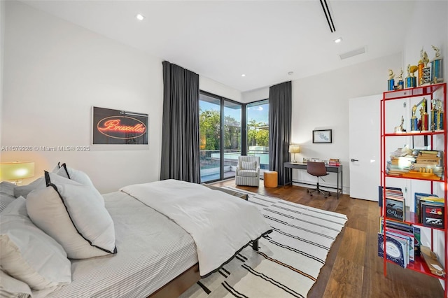 bedroom featuring access to outside, wood finished floors, visible vents, and recessed lighting