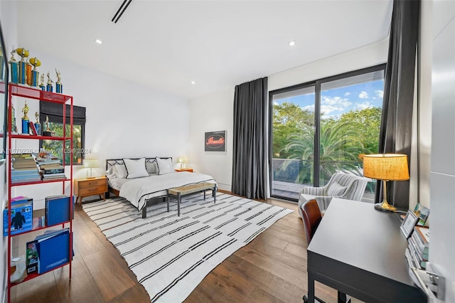 bedroom with hardwood / wood-style floors