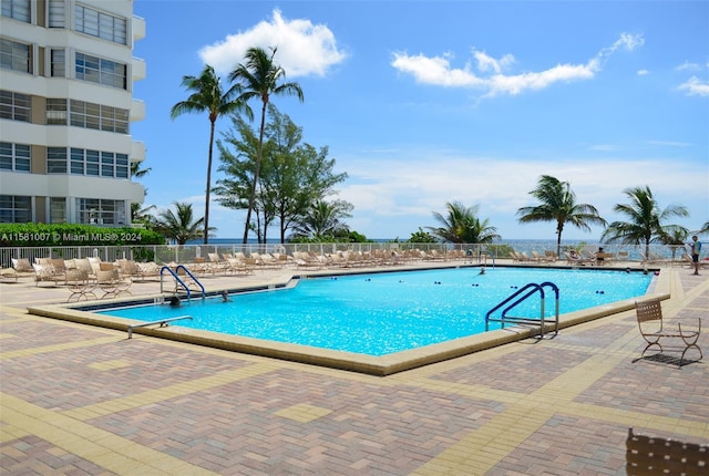 view of swimming pool featuring a patio area