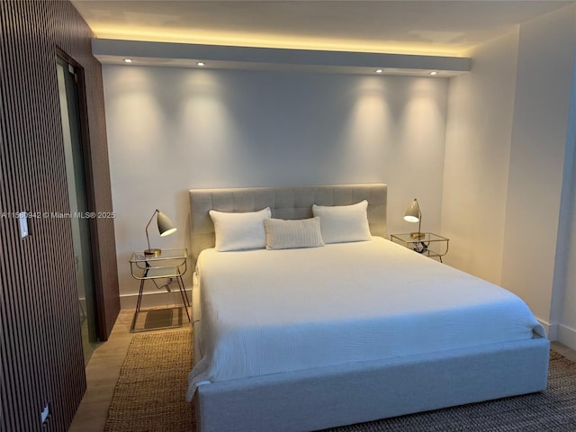 bedroom featuring wood-type flooring