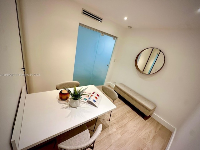 dining area with light hardwood / wood-style flooring