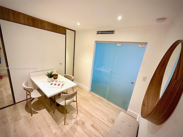 dining room featuring light hardwood / wood-style flooring