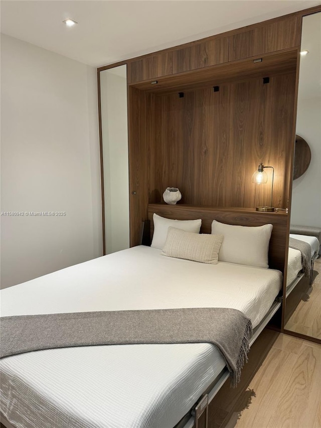 bedroom with light wood-type flooring