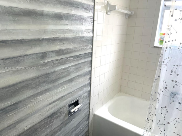 bathroom with shower / bathtub combination with curtain